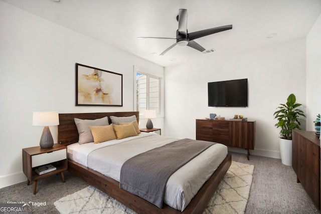 bedroom with visible vents, baseboards, and a ceiling fan