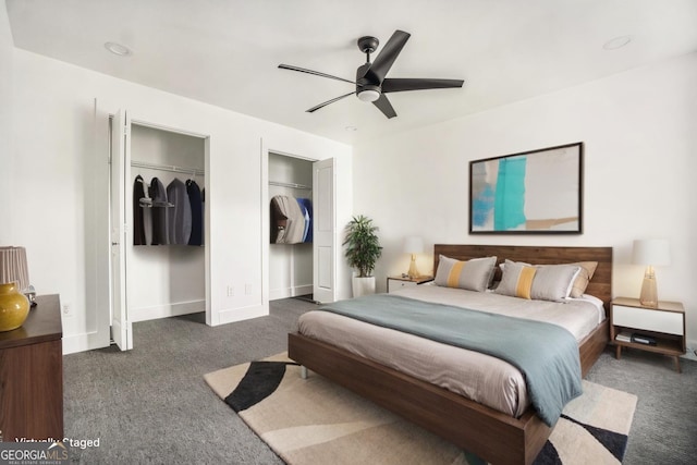 bedroom with baseboards, carpet floors, two closets, and a ceiling fan