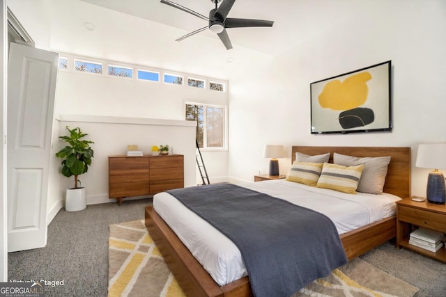 bedroom featuring baseboards, carpet floors, and ceiling fan