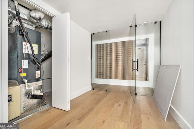 interior space featuring baseboards and wood finished floors