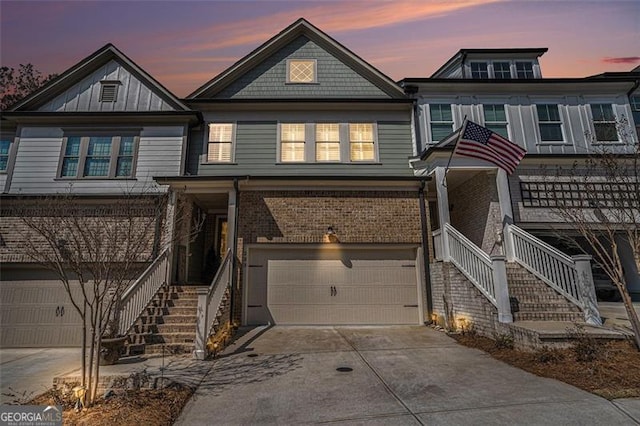 view of front facade featuring a garage, brick siding, and driveway