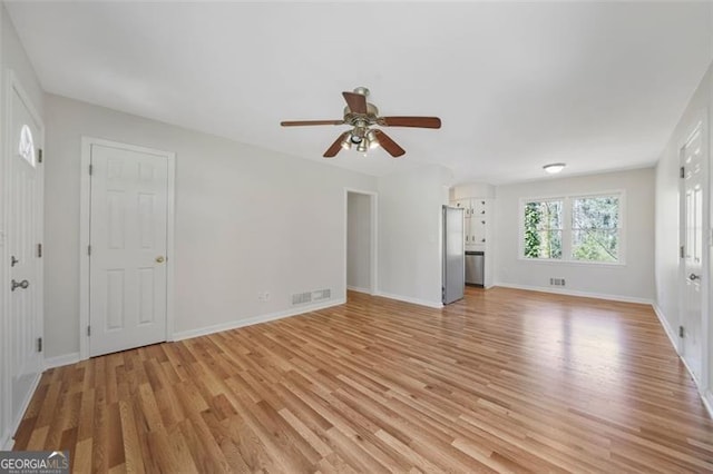 unfurnished living room with visible vents, baseboards, light wood-type flooring, and ceiling fan