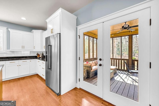 kitchen with plenty of natural light, french doors, and high end fridge