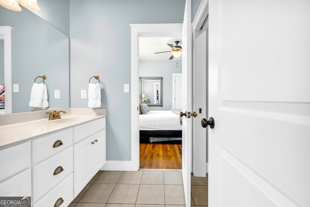 ensuite bathroom with tile patterned flooring, vanity, a ceiling fan, and ensuite bathroom