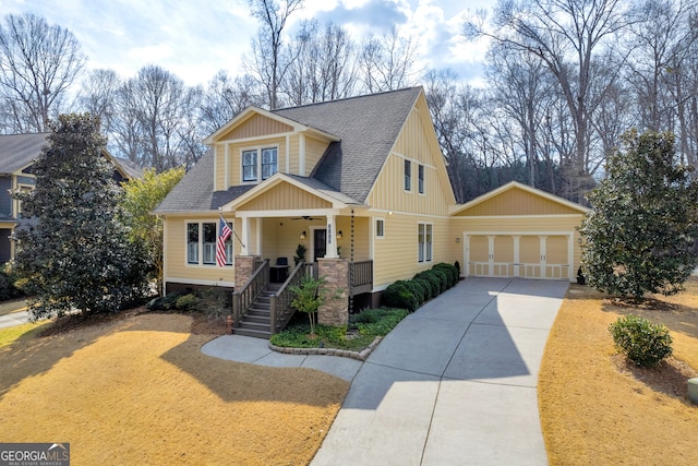 craftsman inspired home featuring a ceiling fan, roof with shingles, a porch, concrete driveway, and a garage