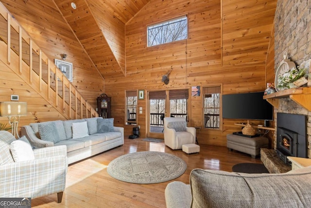 21 Trails End Ln Unit 339, Morganton, GA 30560 - living room with high vaulted ceiling, plenty of natural light, wood walls, a wood stove, and stairs