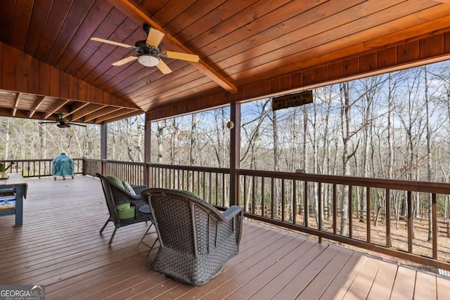 wooden terrace with a ceiling fan