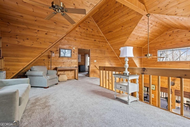 living area featuring wood ceiling, lofted ceiling, a ceiling fan, and carpet floors