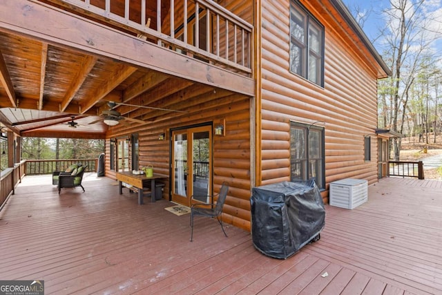 deck featuring a ceiling fan and grilling area