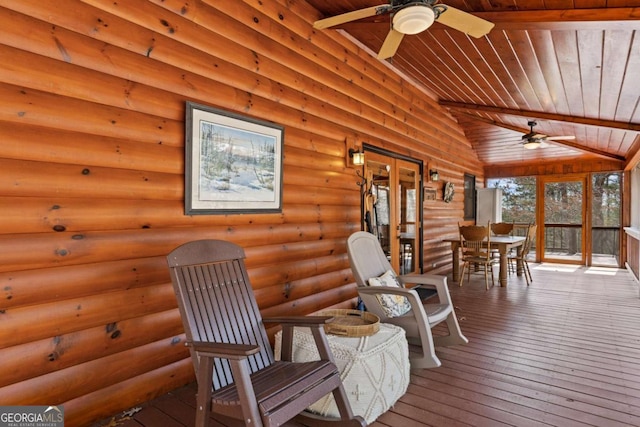 interior space with vaulted ceiling, wood ceiling, and a ceiling fan