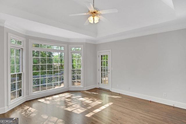 1139 Tennyson Pl NE, Brookhaven, GA 30319 - unfurnished room featuring healthy amount of natural light, wood finished floors, ceiling fan, a raised ceiling, and ornamental molding