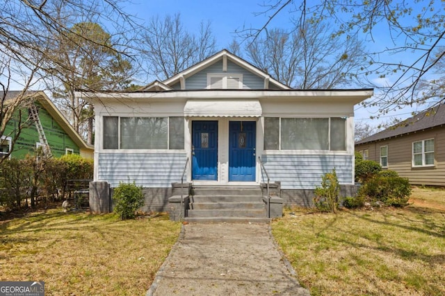 1769 Lyle Ave, Atlanta, GA 30337 - view of front of property featuring entry steps and a front lawn