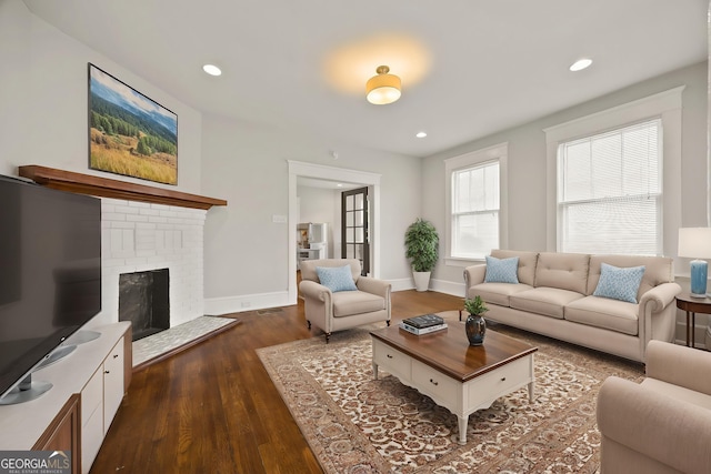 1769 Lyle Ave, Atlanta, GA 30337 - living area featuring dark wood-style flooring, recessed lighting, and a brick fireplace