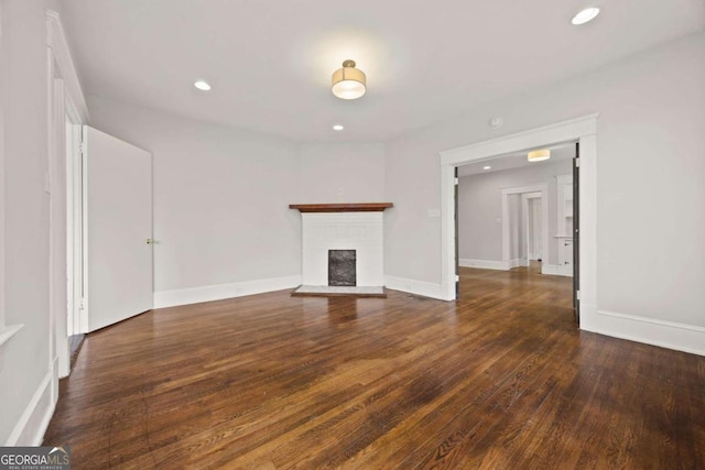 1769 Lyle Ave, Atlanta, GA 30337 - unfurnished living room featuring wood finished floors, recessed lighting, and a fireplace