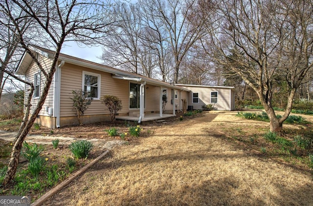 ranch-style home with a front lawn