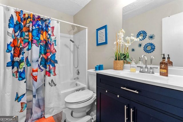 full bathroom featuring shower / tub combo with curtain, toilet, a textured ceiling, and vanity