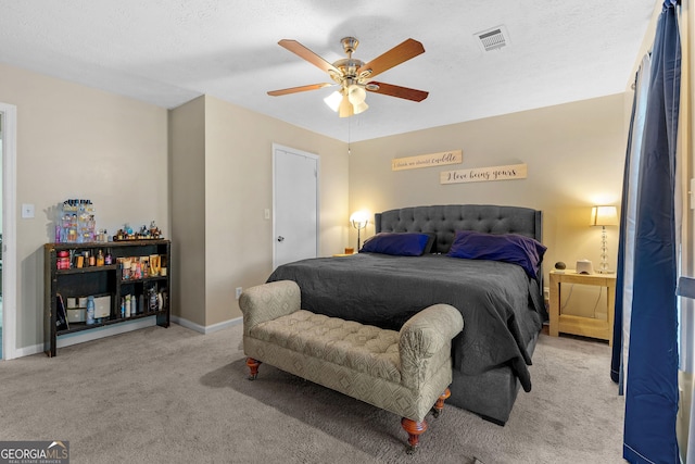 bedroom featuring visible vents, carpet floors, baseboards, and ceiling fan