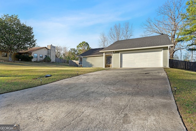 exterior space featuring driveway and fence