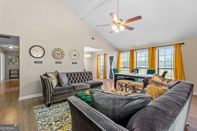 living room with ceiling fan, visible vents, beamed ceiling, and wood finished floors