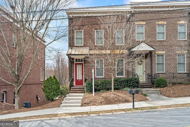 multi unit property with brick siding and central AC unit