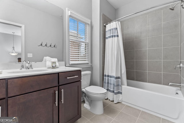 full bath with shower / bathtub combination with curtain, toilet, vanity, and tile patterned flooring