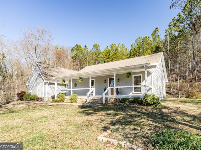 ranch-style house with a porch and a front yard