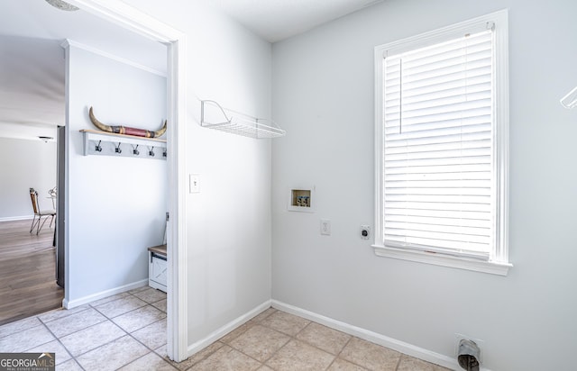 laundry room with washer hookup, light tile patterned floors, baseboards, hookup for an electric dryer, and laundry area