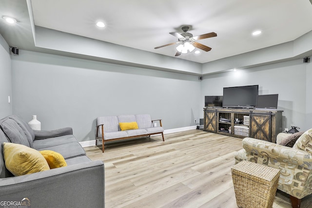 living area with light wood finished floors, recessed lighting, baseboards, and ceiling fan