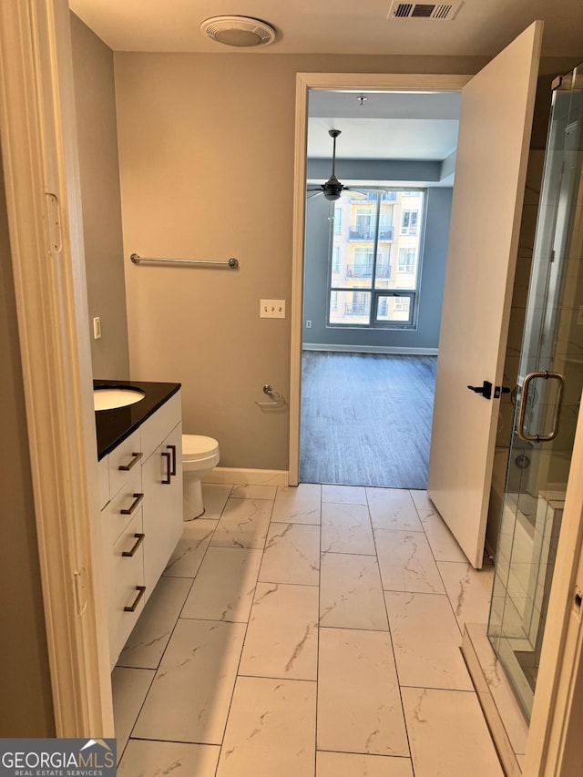 bathroom with vanity, visible vents, ceiling fan, a shower stall, and marble finish floor