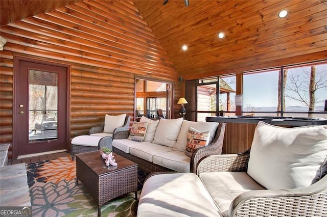 living area with wood finished floors, high vaulted ceiling, recessed lighting, wood ceiling, and rustic walls