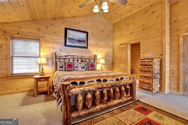 carpeted bedroom featuring ceiling fan, lofted ceiling, wood ceiling, and wood walls