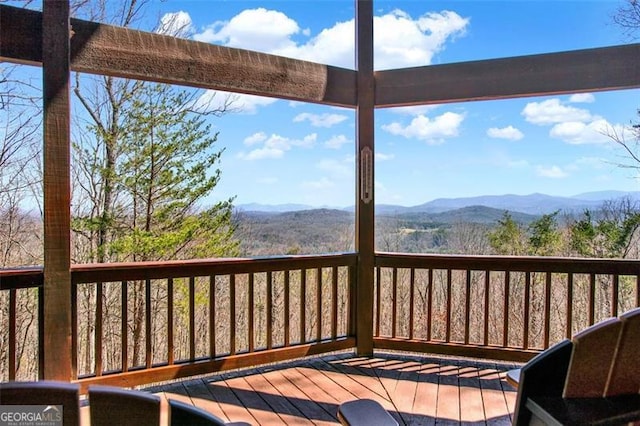 wooden terrace with a mountain view