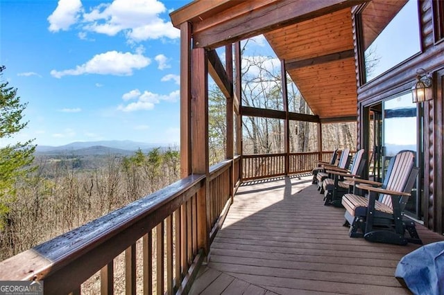 wooden terrace with a mountain view