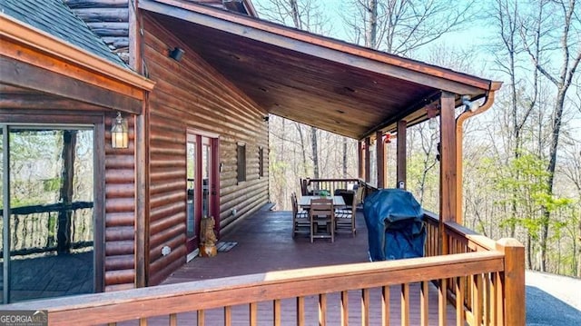 wooden deck with a grill