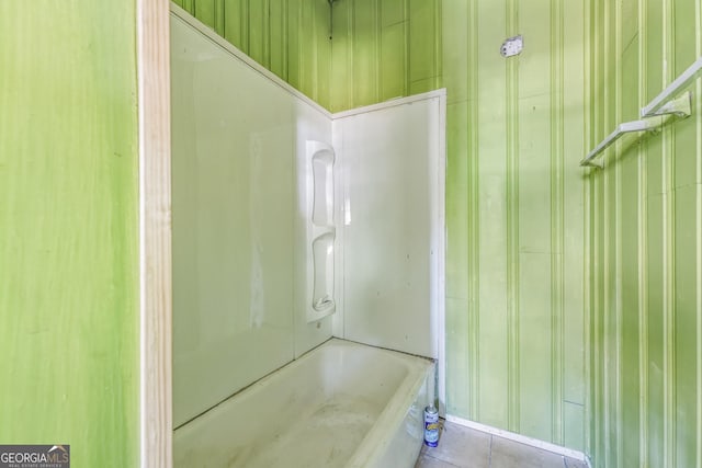 full bathroom with a shower and a tub