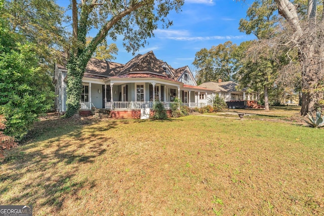 exterior space featuring a front lawn and covered porch