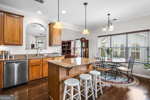 kitchen featuring brown cabinets, a sink, a center island, dishwasher, and dark wood-style flooring