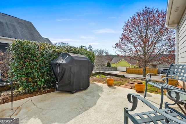 view of patio featuring fence and grilling area