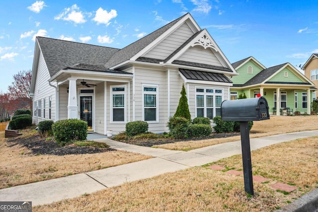 view of front of property featuring roof with shingles