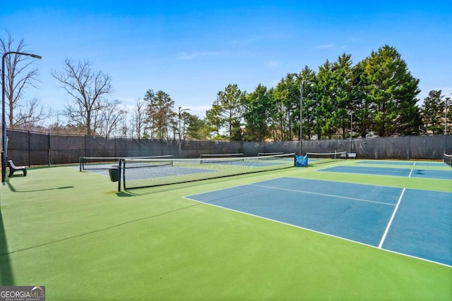 view of sport court featuring community basketball court and fence