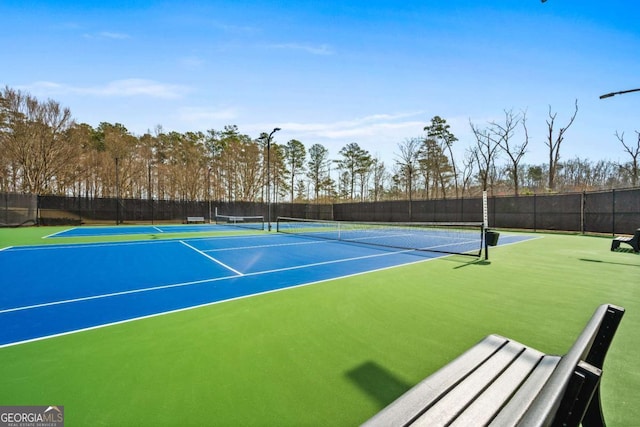 view of sport court with community basketball court and fence