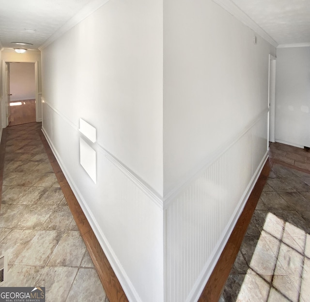 hall with wainscoting and crown molding