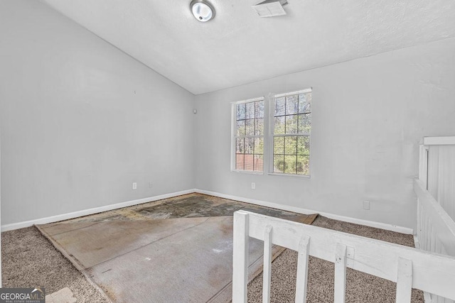 5338 Timor Trl, Lithonia, GA 30038 - carpeted spare room featuring vaulted ceiling and baseboards