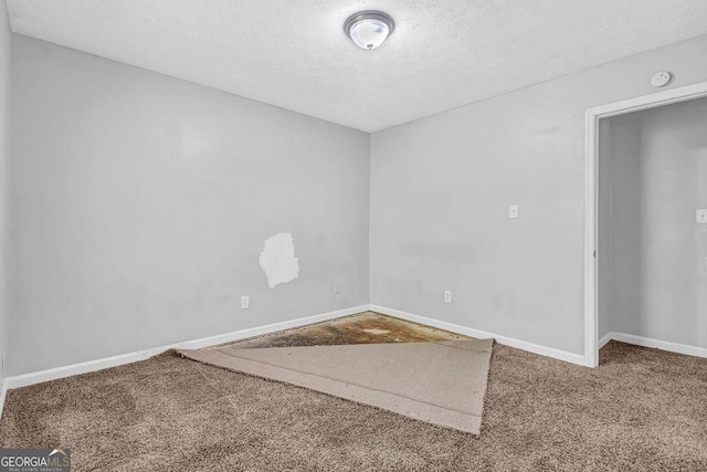 5338 Timor Trl, Lithonia, GA 30038 - carpeted empty room featuring a smoke detector and a textured ceiling