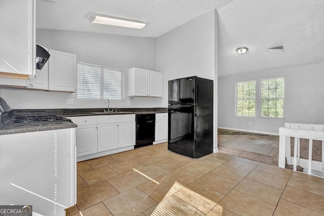 5338 Timor Trl, Lithonia, GA 30038 - kitchen with black appliances, dark countertops, white cabinetry, light tile patterned floors, and high vaulted ceiling