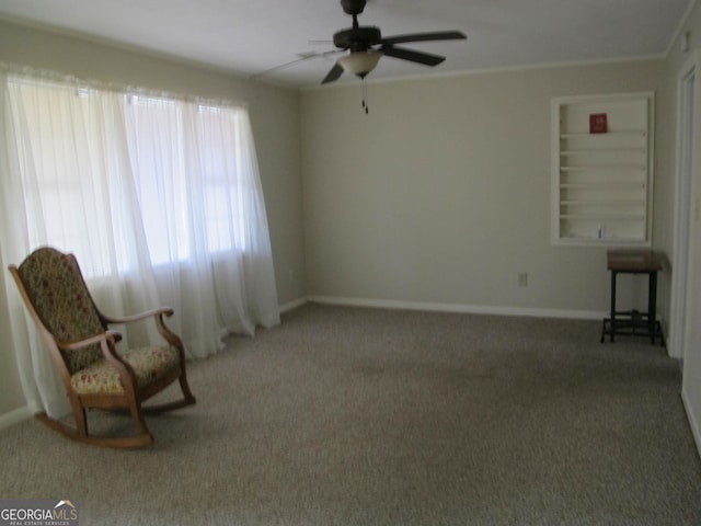 unfurnished room featuring baseboards, crown molding, a ceiling fan, and carpet floors