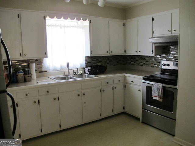 kitchen featuring under cabinet range hood, tasteful backsplash, appliances with stainless steel finishes, and a sink