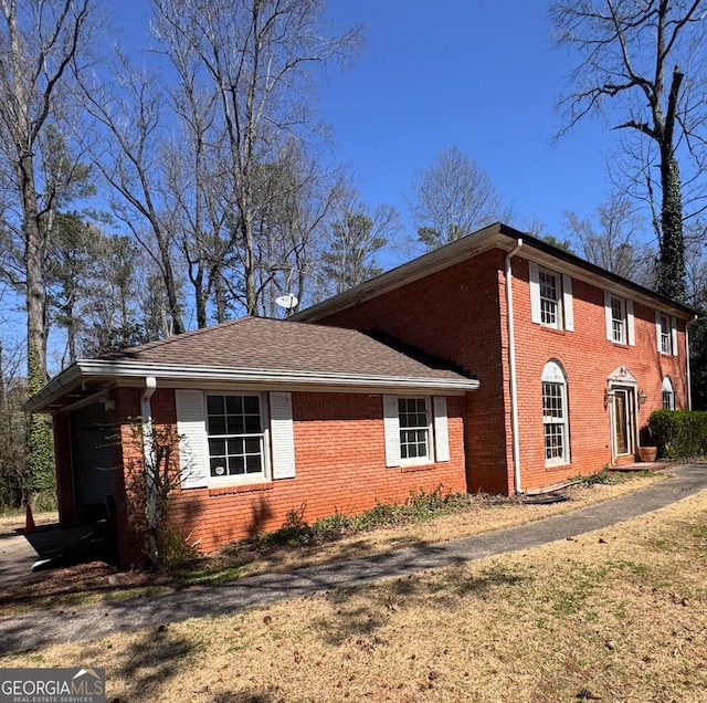 view of home's exterior with brick siding