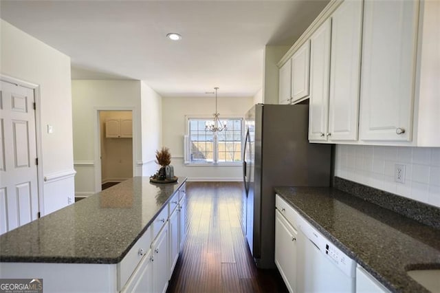 915 Cruce Lake Dr, Hoschton, GA 30548 - kitchen featuring a kitchen island, dark wood-type flooring, a chandelier, decorative backsplash, and white cabinets