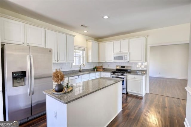 915 Cruce Lake Dr, Hoschton, GA 30548 - kitchen with a sink, white cabinetry, and stainless steel appliances